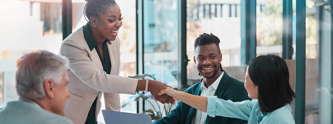 Business team shaking hands during office meeting